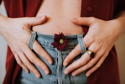 woman touching stomach