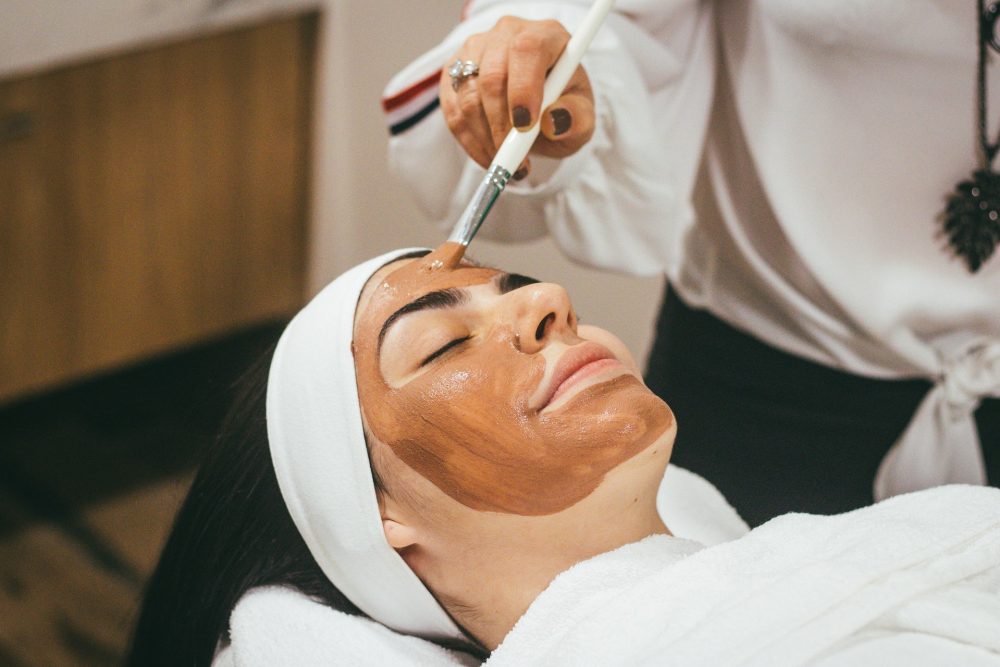woman getting facial in spa