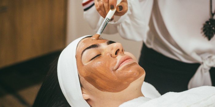 woman getting facial in spa