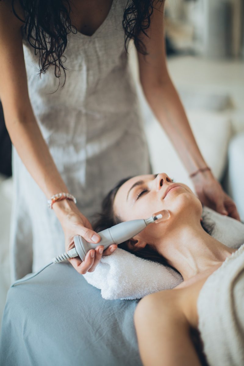 Woman in medi-spa receiving an anti-aging treatment