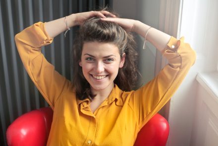 Woman in yellow shirt smiling