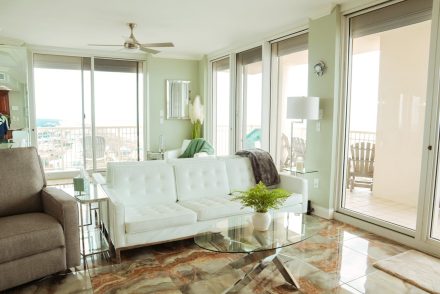 bright and airy living room with white leather couch