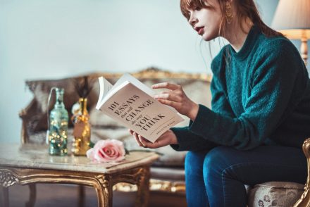 Woman reading on couch